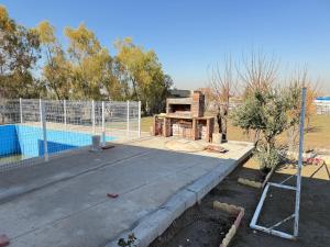 a pool is under construction next to a fence at Happy farm in Erbil