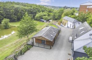 an overhead view of a house and a river at The View - Peaceful Duplex Apartment with Views, Parking & Wifi in Nuneaton