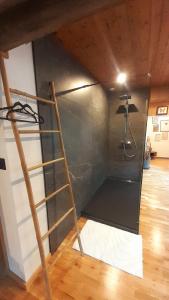 a room with a ladder in the corner of a room at Chambre d'hôte de la Source Bleue in Cusance +39 photos