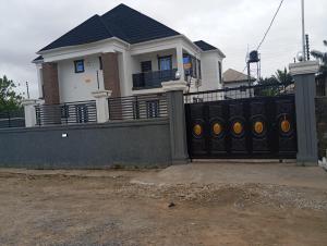 a house with a black fence in front of it at Dipo Apartments in Badore +2 photos