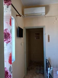 a room with a air conditioner on the wall at Livanos Apartments in Neapoli Voion