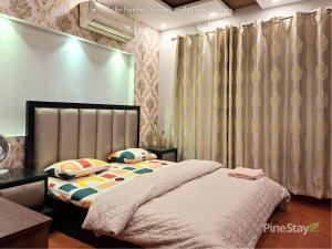 a bedroom with a bed with a headboard and curtains at Pine Stay Premium 3 Bedroom Furnished Family Home in Lahore +17 photos