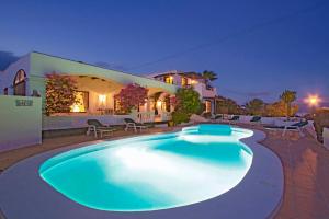 a large swimming pool in front of a house at Villa Dune in La Asomada
