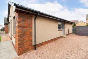 a brick building with a solarium on the side of it at Ellaburn in Barry