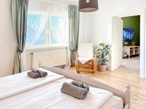 a bedroom with two beds and a window at GurkenLoft in Lübbenau