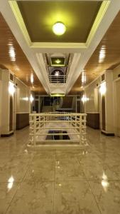 a large room with a white altar on the floor at Paper Country Inn in Mangagoy