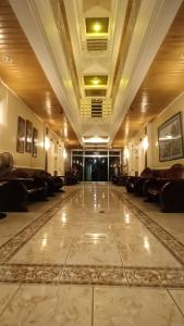 a large lobby with couches and a large floor at Paper Country Inn in Mangagoy