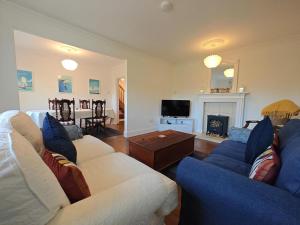 a living room with two couches and a fireplace at 2 Bed in Brighstone oc-n30464 in Brighstone