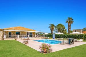a house with a swimming pool in a yard at Villa Zante Ruby by Villa Plus in Katastárion