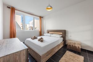 a bedroom with a bed and a large window at Blue Haven Talea by PikHost in Tale +32 photos