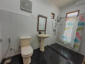 a bathroom with a toilet and a sink at Dream Stay Green in Nuwara Eliya +111 photos
