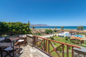 a view of the beach from the balcony of a villa at Drapanias BeachFront Apartments - Marinakis in Kissamos
