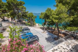 a resort with a view of the water at Villa Rosea in Slatine