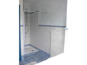 a bathroom with a shower and a tub and a sink at Viktor-Jaeger-Stiftung in Nebel +14 photos