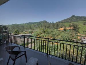 a balcony with a view of a mountain at Dream Stay Green in Nuwara Eliya