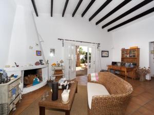 a living room with a couch and a fireplace at VILLA EN CAP EN FONT in Cap d'en Font