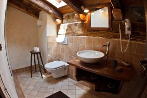 a bathroom with a sink and a toilet at La Maison D'Antan in Bionaz +67 photos