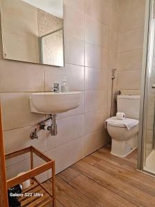 a bathroom with a sink and a toilet at APT Copacabana-Es Pujols playa in Es Pujols +40 photos