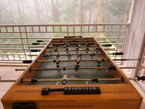 a snooker table with people on top of it at Vamsi's Woodside in Yercaud +27 photos