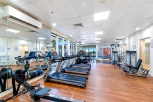a gym with rows of treadmills and elliptical machines at L17 Small Studio Suite 2 Beds Pool Spa in Gold Coast