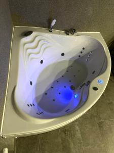 a white bath tub with a blue inside at Villa 121 Várgesztes in Várgesztes +21 photos