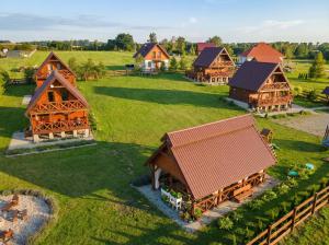 an overhead view of a model village with wooden houses at Cichosza Miłomłyn in Miłomłyn