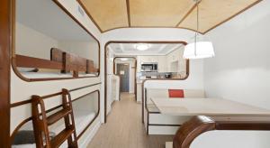 an interior view of an rv with a table and chairs at Mariner's Boathouse and Beach Resort by CoolVacay in Fort Myers Beach