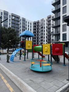 a playground with different types of play equipment at Silk Road Retreat City Center in Bukhara