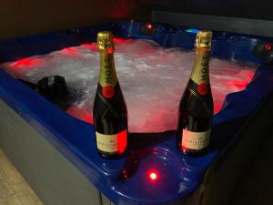 two bottles of wine in a hot tub at Wellness & Spa Zaprešić in Jablanovec