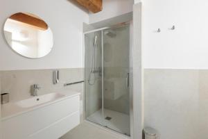 a bathroom with a shower and a sink and a mirror at Palazzo Simonetti in Ascoli Piceno +23 photos