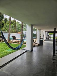 a lobby with a hammock in a resort at Luxurious Quinta House in Fernando de la Mora