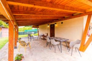 an outdoor patio with a table and chairs at house Al Cascinale in San Severino Marche