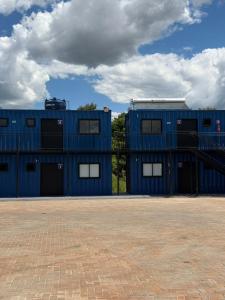 a blue building with windows on the side of it at Arena Bitz in Pato Branco