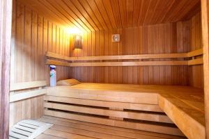 a wooden sauna with a bench in it at Cuencaloft Casa Rural Eloy in Carboneras de Guadazaón