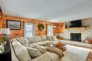 a living room with a couch and a fireplace at 15 off Summer Special - Wifi - Pet Friendly in Sigel