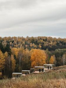a group of buildings sitting on top of a hill at Дзеркальний будинок Botan in Malaya Bugayevka