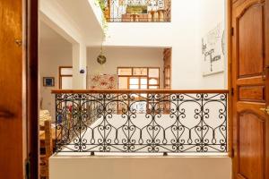 a balcony with a iron railing in a house at Appart Ayoub in Essaouira