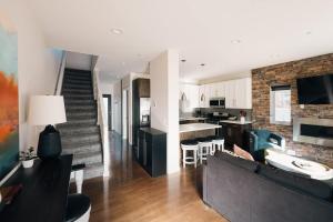 a living room and kitchen with a couch and a table at Lakefront - Trails - Skiing - Views - Georgetown in Georgetown
