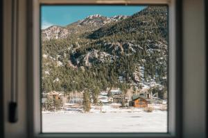 a view of a mountain through a window at Lakefront - Trails - Skiing - Views - Georgetown in Georgetown +51 photos