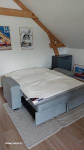 a bed sitting in a room with a mattress at Maison de 50m2 à la campagne in Pirmil