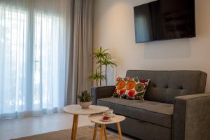 a living room with a couch and a table at Casa Diez in Estepona