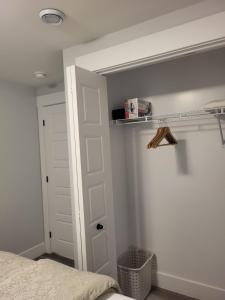 a bedroom with a bed and a white door at Peace Home in Dieppe