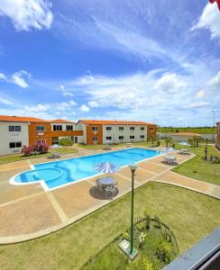 an image of a swimming pool at a building at Hotel Kariña Punta de Mata in Punta de Mata