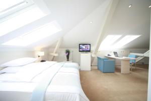 Un pat sau paturi într-o cameră la Hotel Navigare