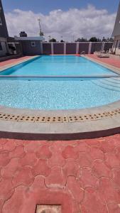 a swimming pool on top of a building at Seasalt & Sand in Mtwapa