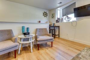 a living room with two chairs and a table at Dtwn Walkability! Grand Junction Couple's Retreat in Grand Junction