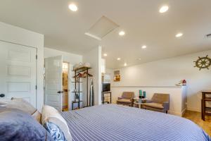 a bedroom with a bed and two chairs in it at Dtwn Walkability! Grand Junction Couple's Retreat in Grand Junction