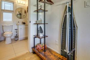 a room with a bathroom with a toilet and shelves at Dtwn Walkability! Grand Junction Couple's Retreat in Grand Junction +16 photos