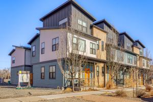 an apartment building with a black roof at Dtwn Walkability! Grand Junction Couple's Retreat in Grand Junction