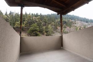 an empty balcony with a view of a mountain at Deli Home in Kastoria